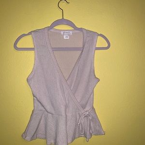 Medium, cream colored blouse.